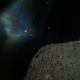 Image captured by Rover-1B on September 21 at around 13:07 JST. This color image was taken immediately after separation from the spacecraft. The surface of Ryugu is in the lower right. The coloured blur in the top left is due to the reflection of sunlight when the image was taken.